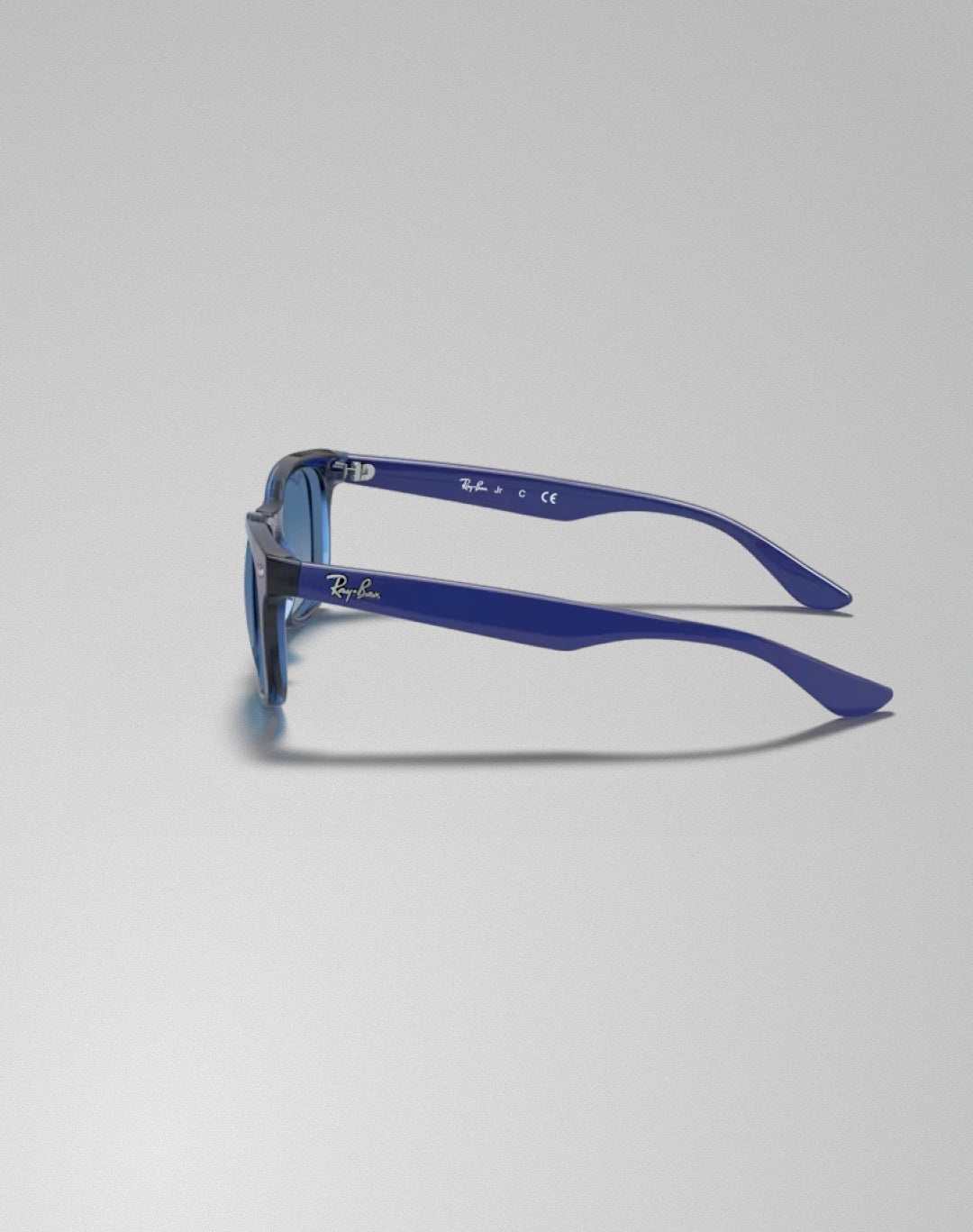 Ray-Ban 0RJ9052S-70624L – Lunettes de soleil carré transparent bleu
